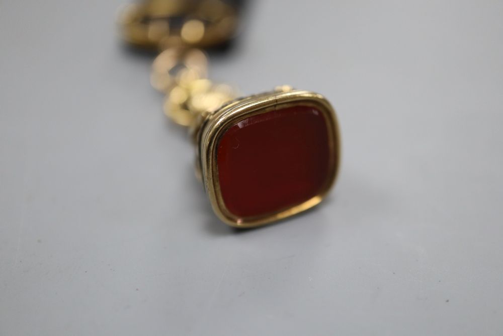 A Victorian yellow metal overlaid and carnelian set fob seal, with 9ct mounted ribbon sash with bale, seal 27mm,